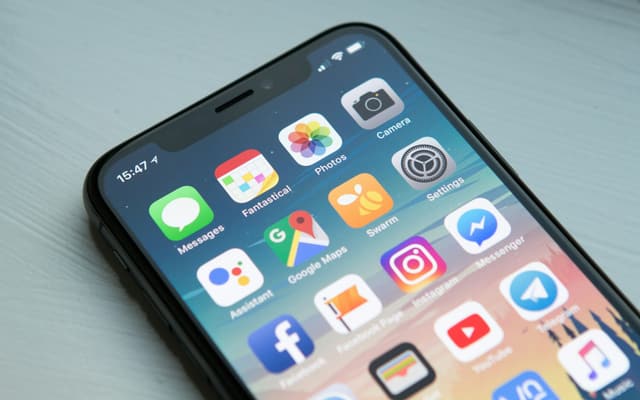 A smartphone home screen filled with application icons