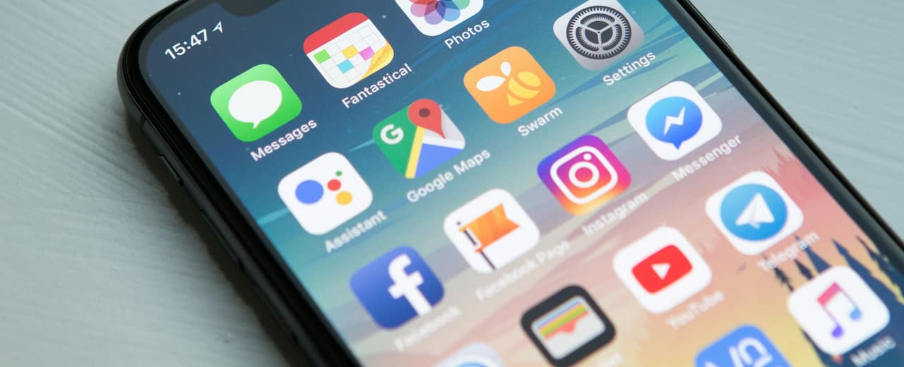 A smartphone home screen filled with application icons