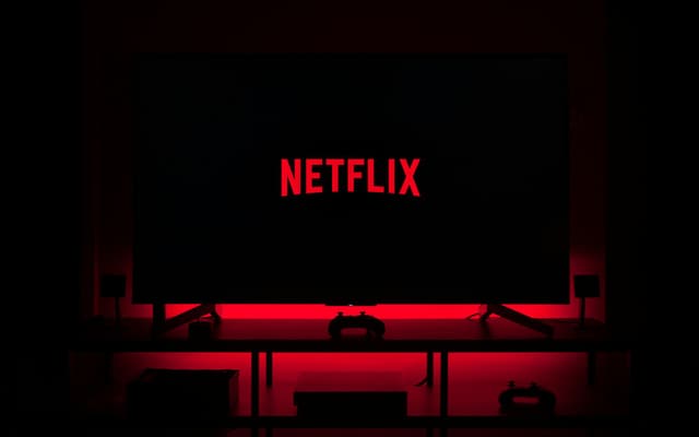 A television screen glowing in a dark room