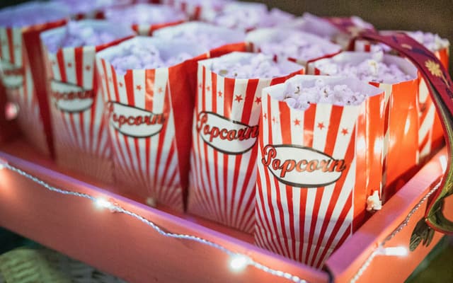 Boxes of popcorn lined up at a cinema counter