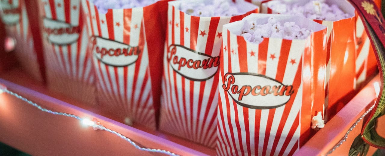 Boxes of popcorn lined up at a cinema counter