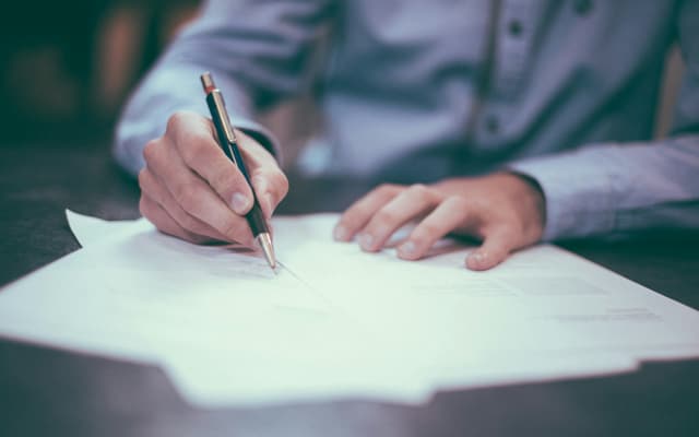 Corporate documents spread across a desk