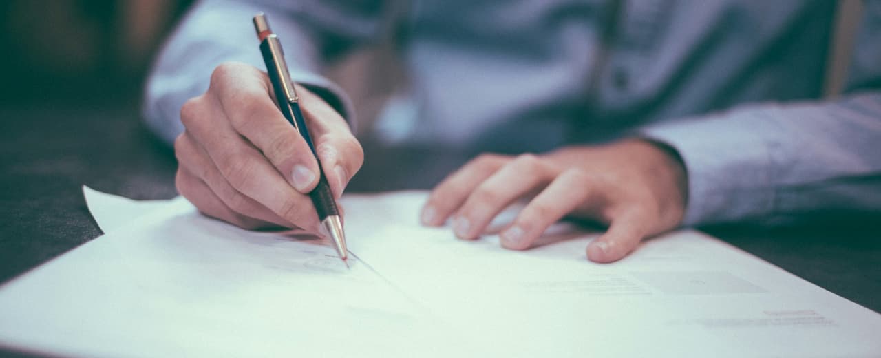 Corporate documents spread across a desk