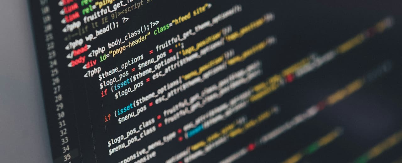 Program source code displayed on a dark screen