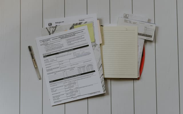 A person weighing up options at a desk