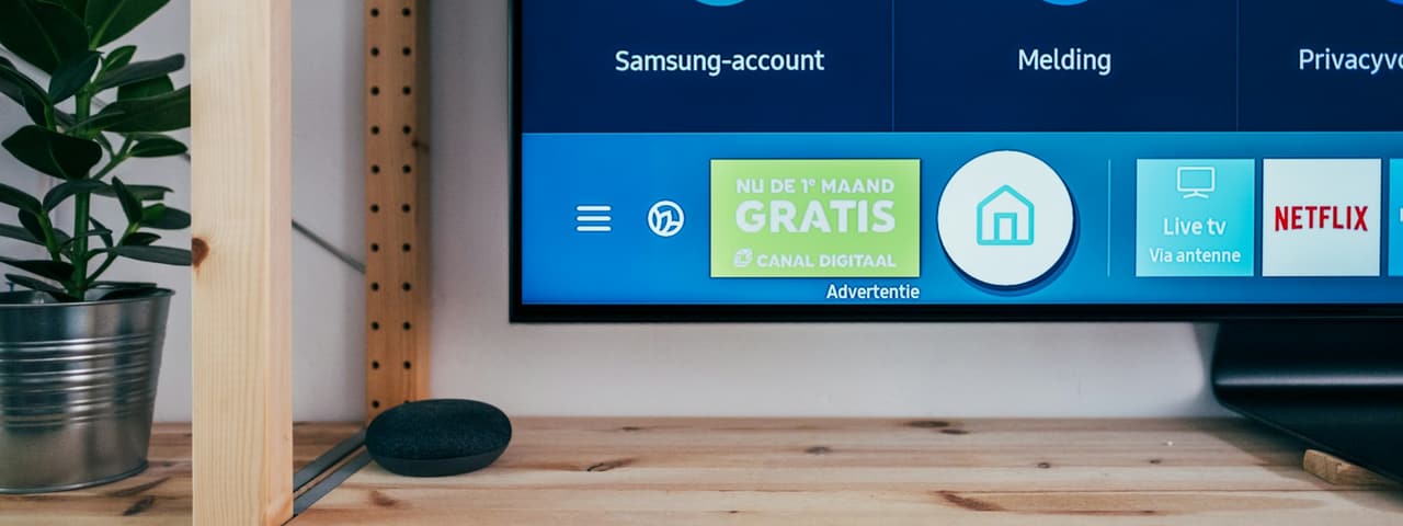 A smart TV home screen showing streaming apps