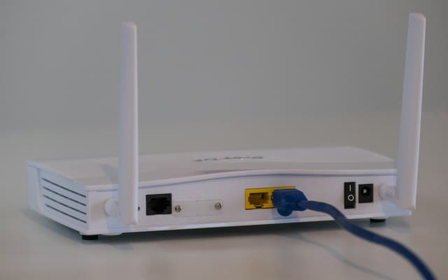 A home wireless router with an ethernet cable attached