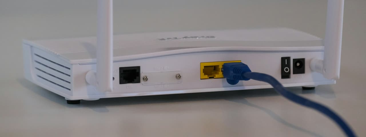 A home wireless router with an ethernet cable attached