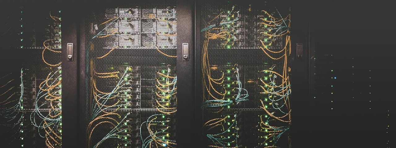Racks of servers in a dark data centre